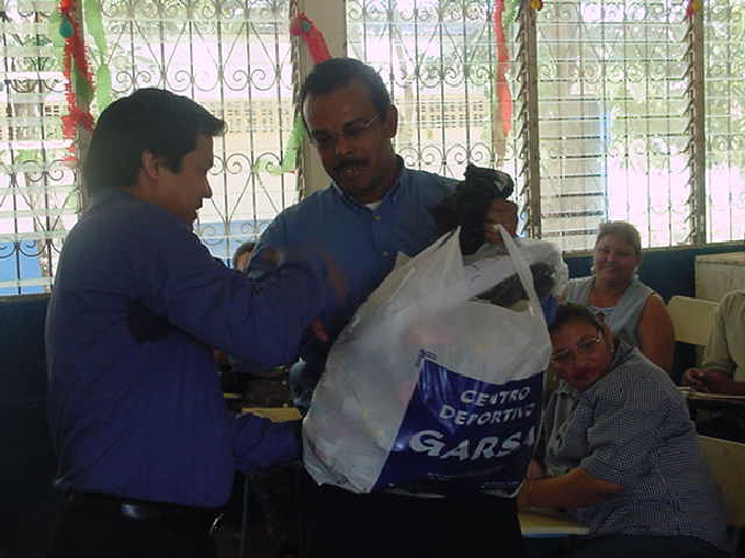 Sports utilities were given to the participating schools for their sports teams. At the left Jose Felix Sanchez, M.D.