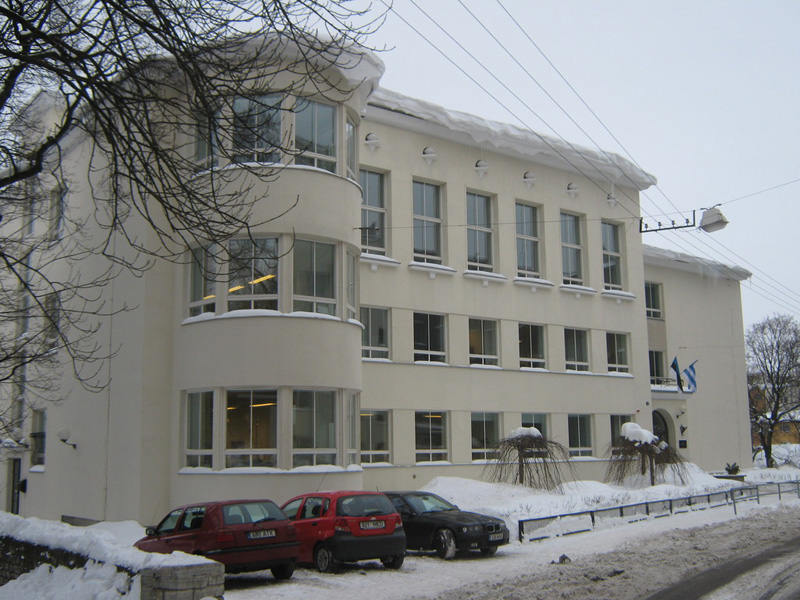 A school from the 1930-ies  in Tallinn in winter (with Estonian and Tallinn flags)